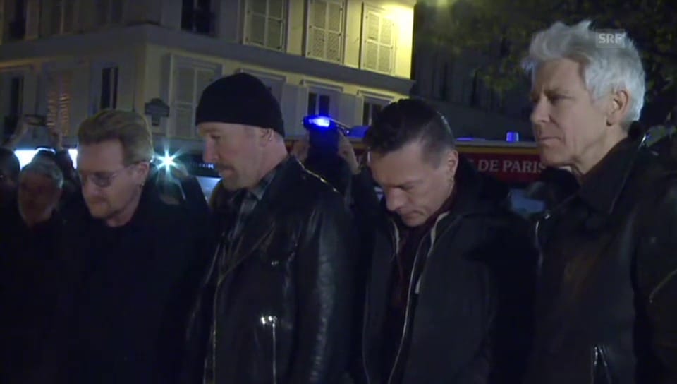 U2 legen in Paris Blumen nieder (unkomm.)