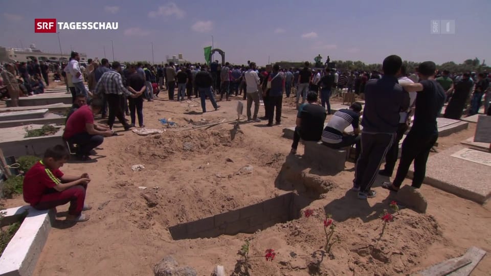 Reportage: Die Toten werden beigesetzt